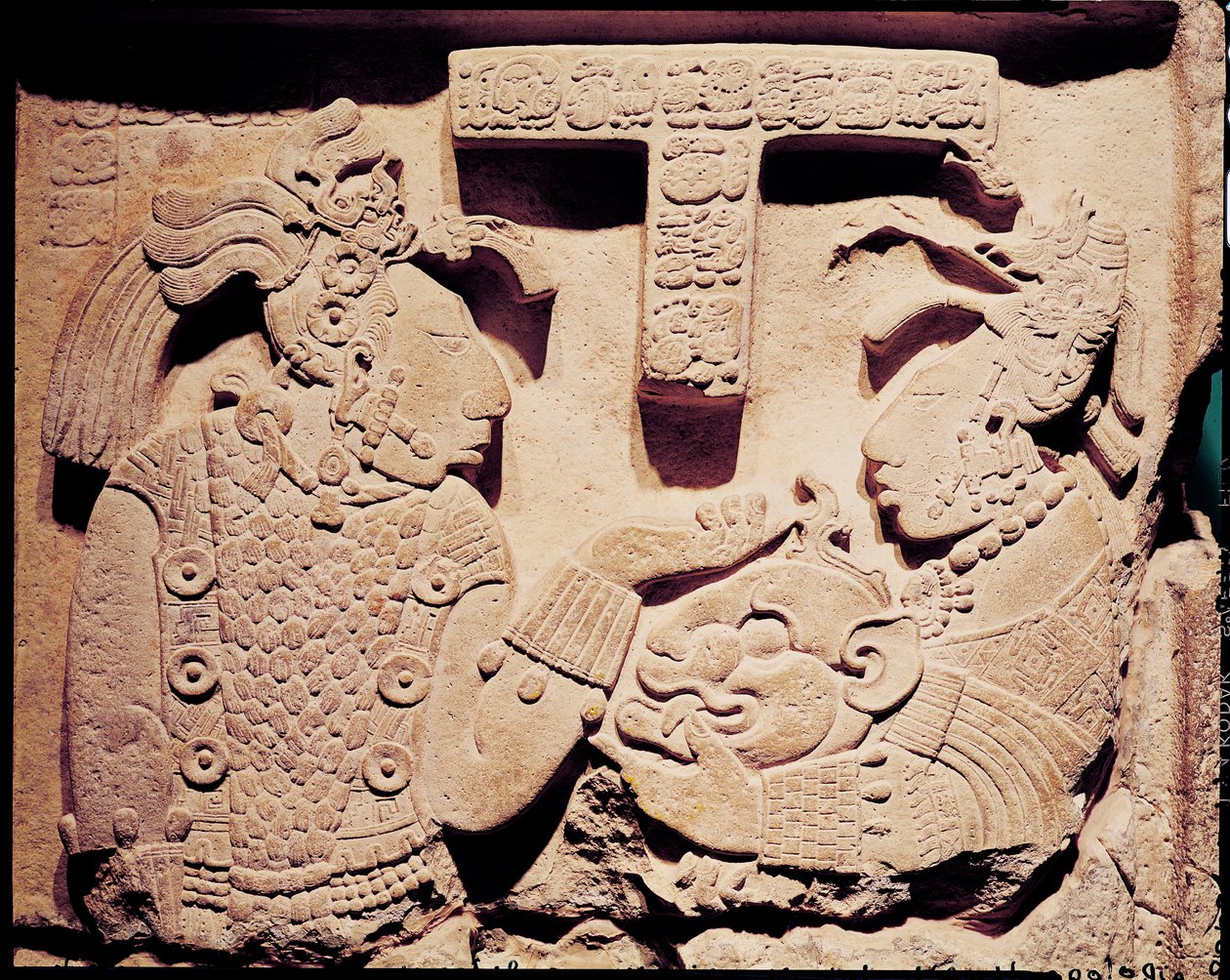 Stela depicting a woman presenting a jaguar mask to a priest, from Yaxchilan by Mayan
