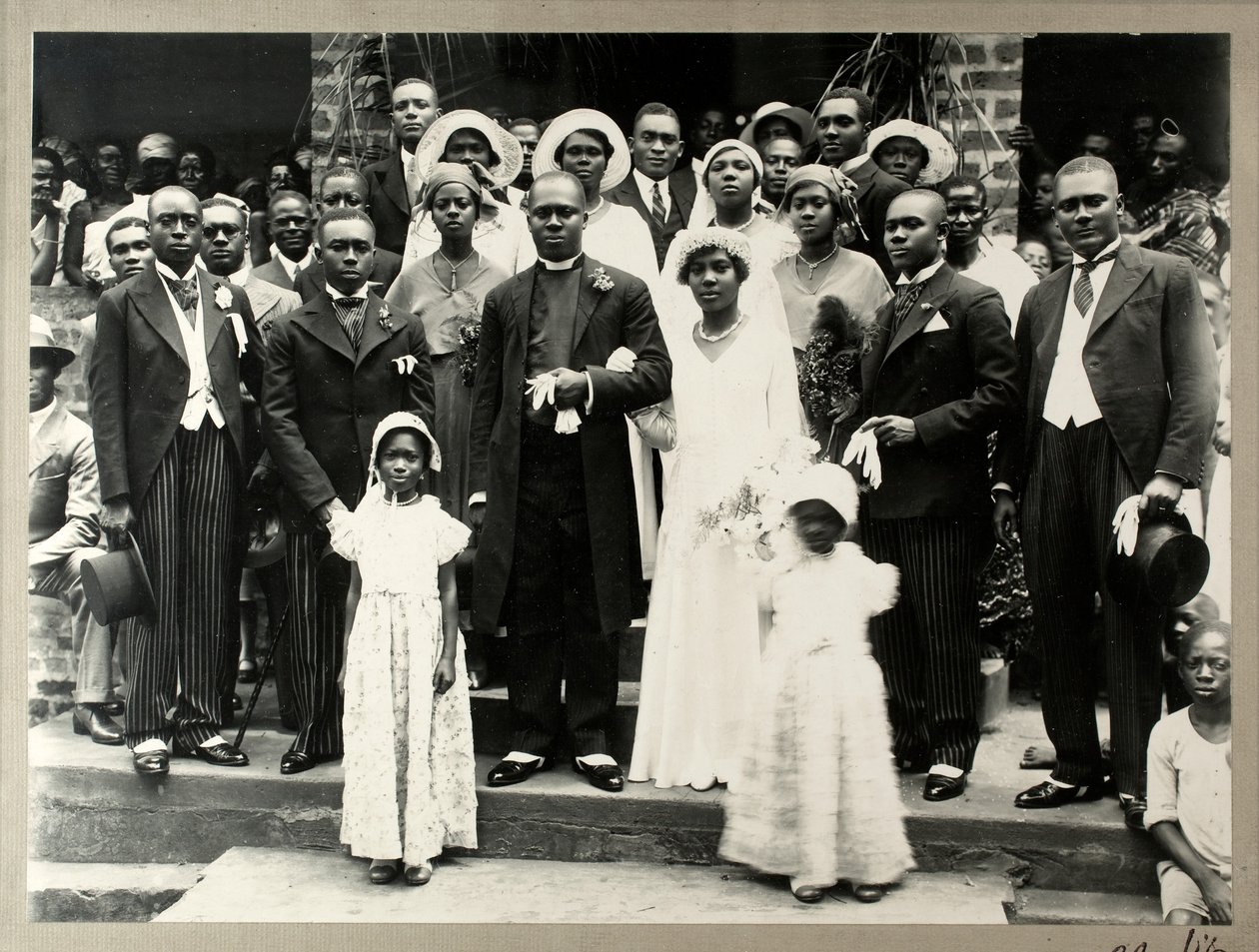 Wedding party of Revd Prempeh, son of the late King Prempeh and Miss Mary Asafu-Adjaye, c.1931 by N. T. Clerk