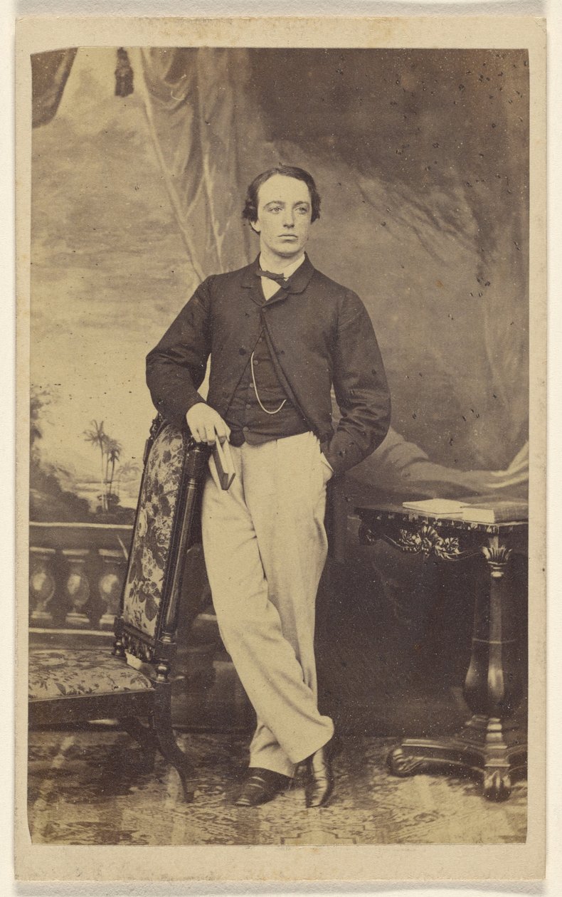 Unidentified man, standing by Pearson and Patterson