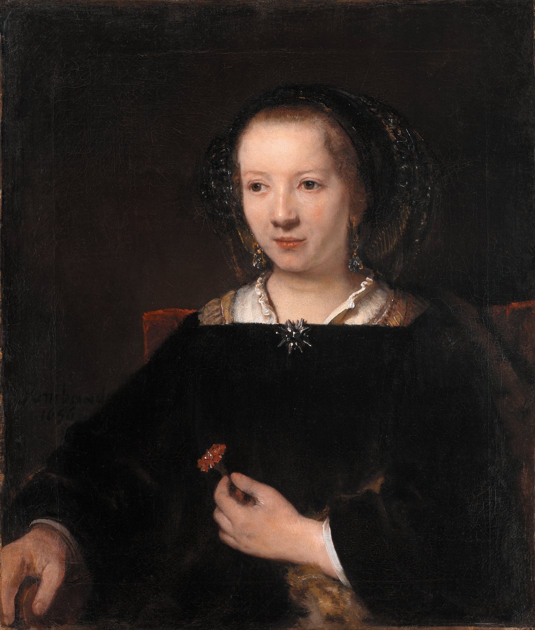 Young Woman with a Carnation by Rembrandt van Rijn