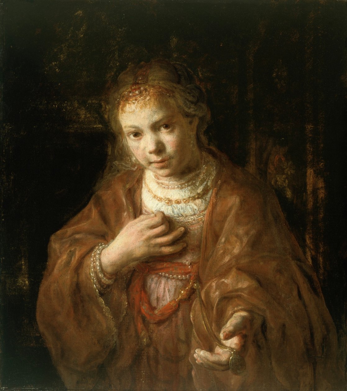 Young Girl Holding a Medal by Rembrandt