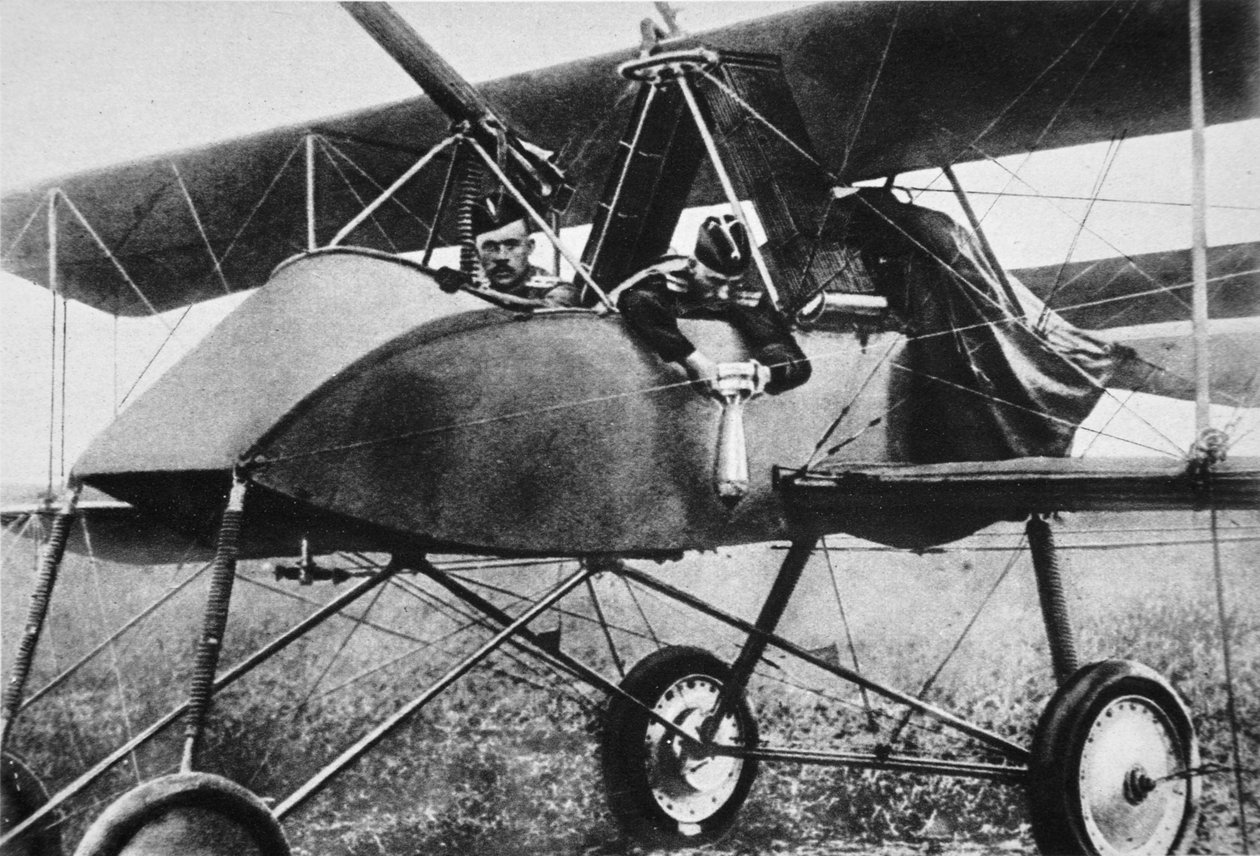 Fastening a bomb before starting, the Airmen of our ally on the Eastern Front, from The Illustrated War News, 1916 by Russian Photographer