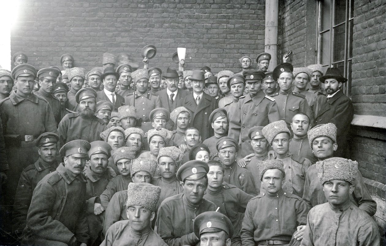 Soldiers of the Volinsky unit with non-commissioned officer T. L. Kirpichnikov and representatives of workers associations of England, St Petersburg, February 1917 by Russian Photographer
