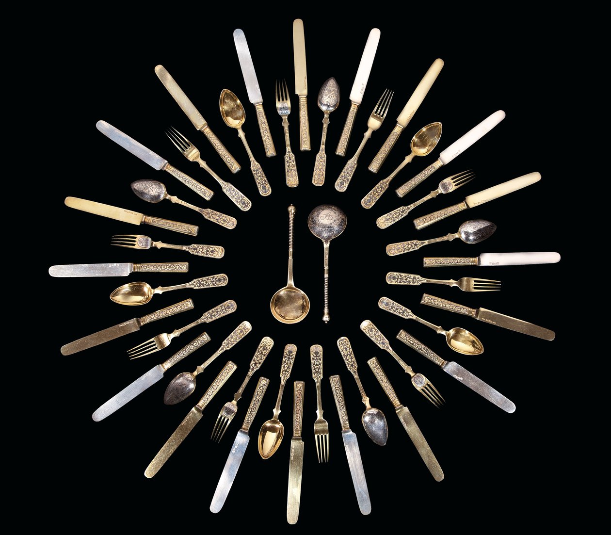 A silver-gilt and niello flatware service by School Russian