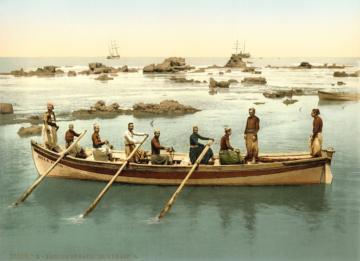 Boat with people rowing in the harbour of Jaffa by Swiss Photographer