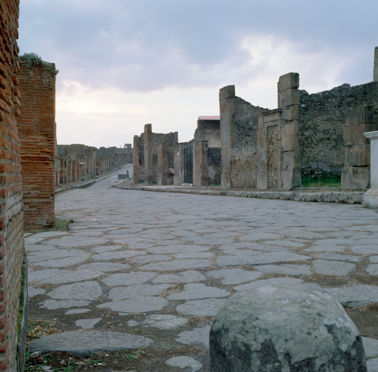 A cobblestone Roman road in Pompeii, Italy by Unbekannt