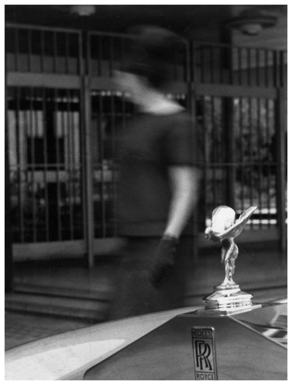 Woman Walking Past a Rolls-Royce by Unbekannt