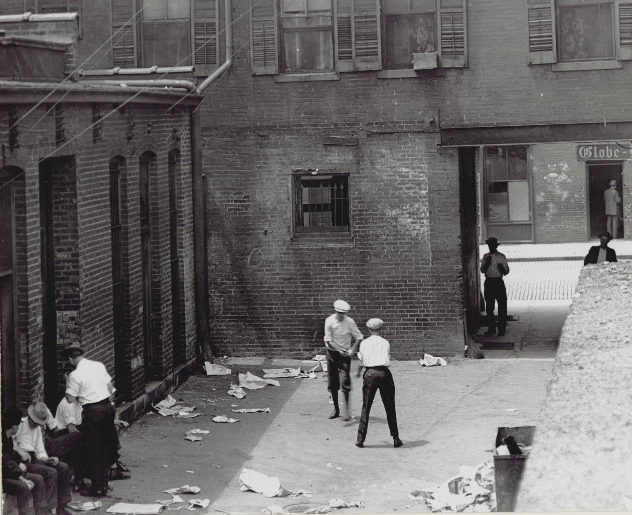 Group of Men and Boys in an Unidentified Courtyard-Alley by Unknown