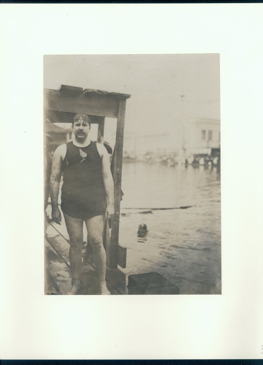 Wet Man in a Swimsuit on a Dock Beside a Lake by Unknown