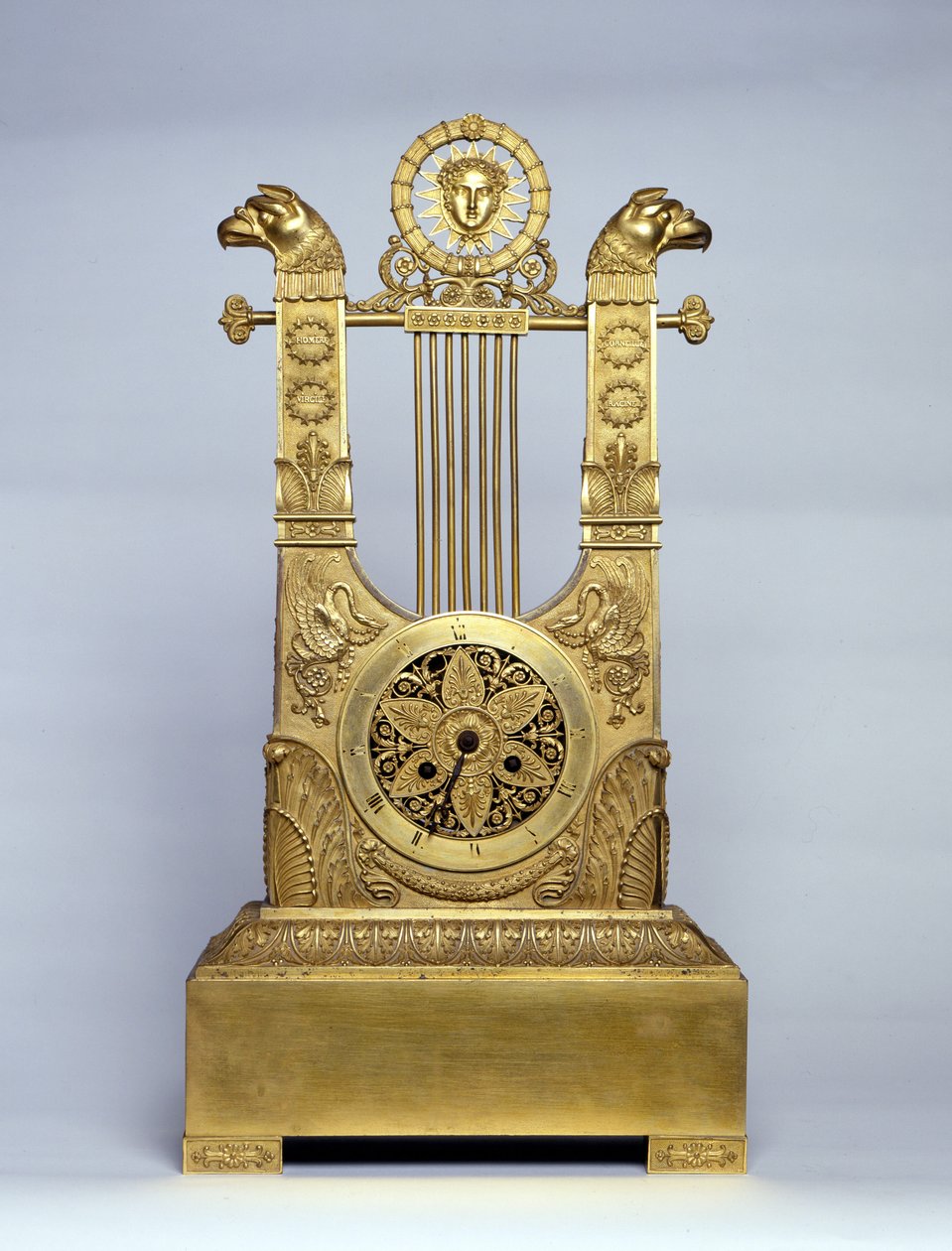 Harp shaped fireplace clock. by Unknown artist