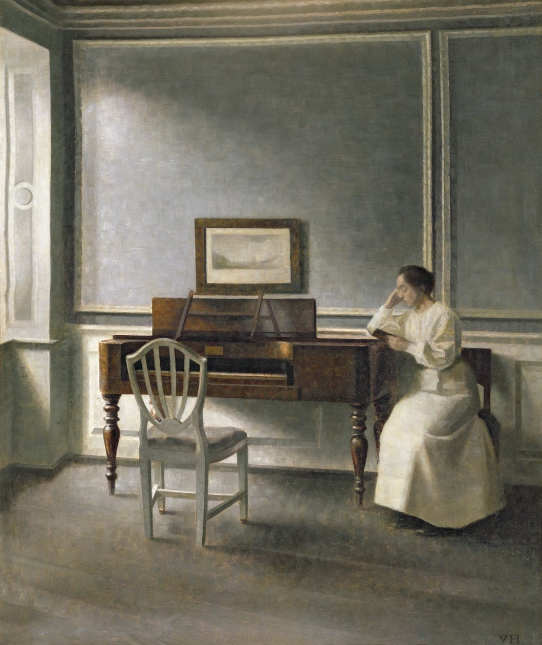 Woman Reading by a Piano by Vilhelm Hammershoi