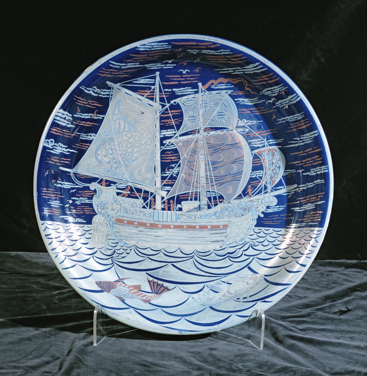 Charger with silver lustre with a galleon sailing on a silver lustre sea by William de Morgan