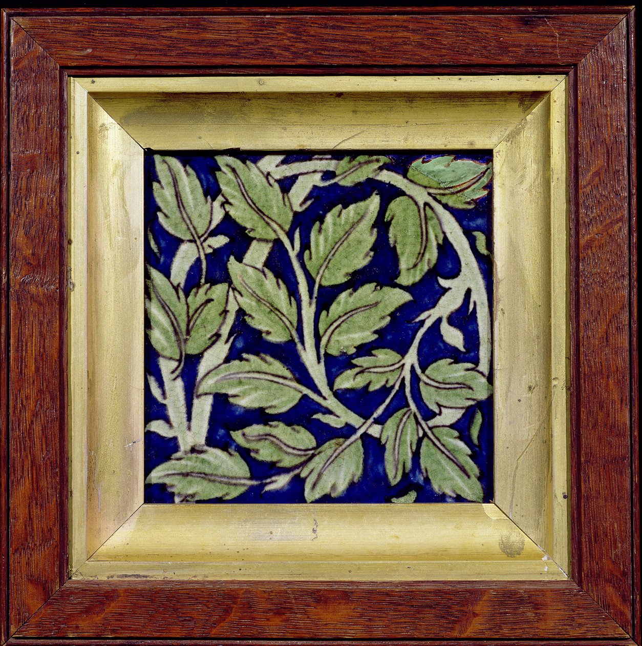 Tile with a leaf design by William de Morgan
