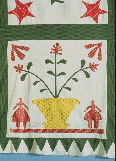 Quilt (detail) showing figures and flowers by American School