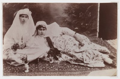Women posing with bouquets by Antoin Sevruguin