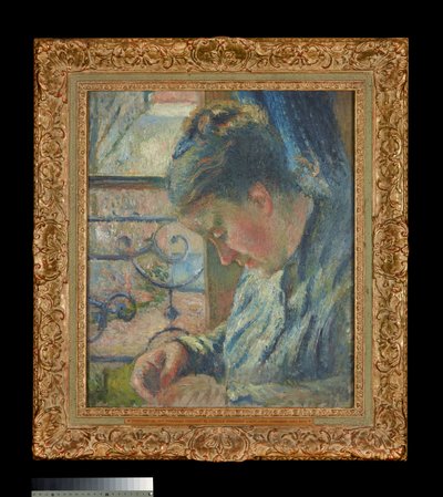 Julie Pissarro Sewing Beside a Window by Camille Pissarro