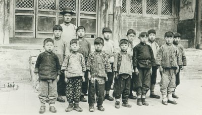 Schoolteacher and pupils by Chinese Photographer