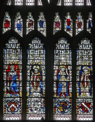 Window depicting figures and shields below by English School