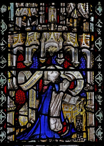 Window n4 depicting a cleric with scroll by English School