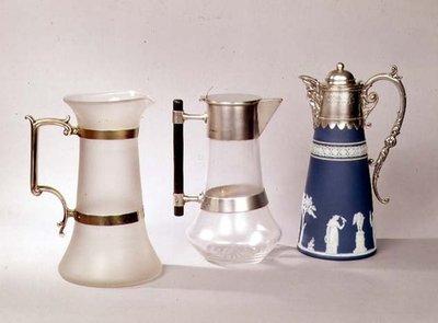 Three claret jugs by English School English School