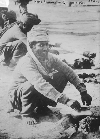 Indian soldier cooking in France by French Photographer