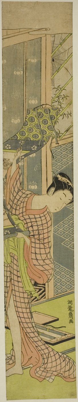 Young Woman Hanging a Painting by Isoda Koryusai