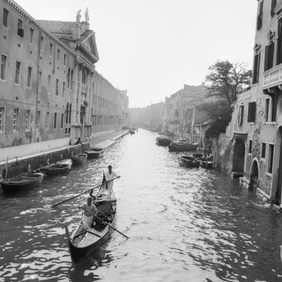 Gondoliers on a canal in Venice by Italian Photographer