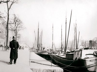 Policeman by a canal, Rotterdam by James Batkin