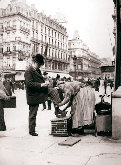 Woman polishing shoes, Brussels by James Batkin