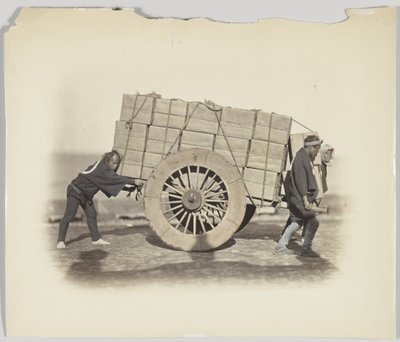 Men hauling a cart by Japanese Photographer