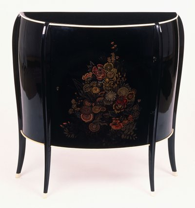 A bow-front chest of drawers by Jean Dunand