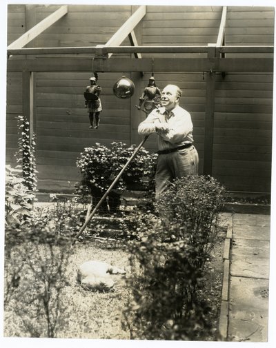 Tony Sarg in his garden by Jessie Tarbox Beals