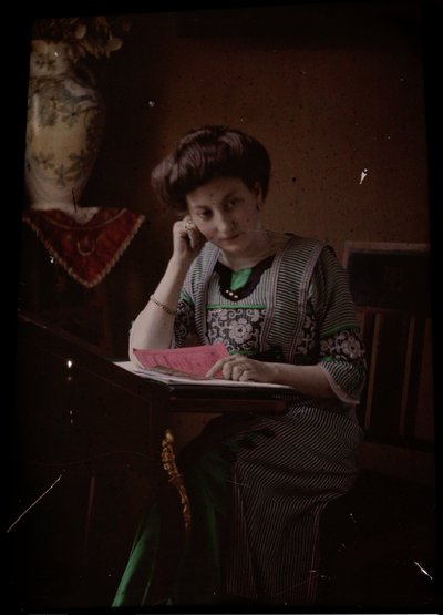 Woman Behind Reading Table by Johannes Hendrikus Antonius Maria Lutz