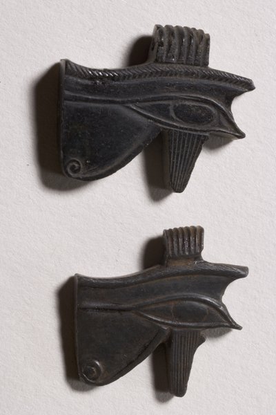 Two wedjat eye amulets by Late Period Egyptian