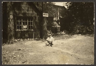 Figure Sitting on a Rock by Louis Fleckenstein