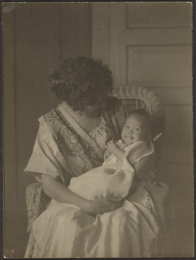 Florence Holding Baby in Rocking Chair by Louis Fleckenstein