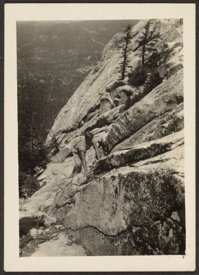 Hiker Climbing on Boulder by Louis Fleckenstein
