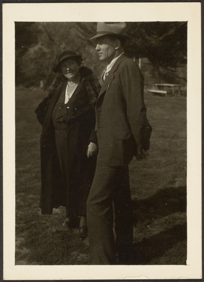 Man and Woman Standing in Grass by Louis Fleckenstein