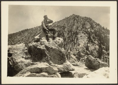 Man Seated on Rocks by Louis Fleckenstein