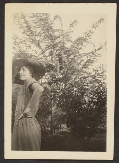 Woman in Hat Standing in Orchard by Louis Fleckenstein