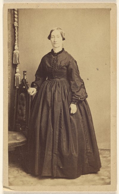 Unidentified woman, standing by R. A. Lord