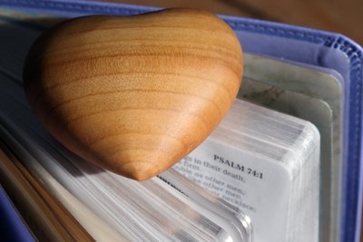 Carved Wood Heart on a Holy Bible by Unbekannt