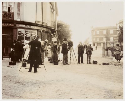 Group of photographers taking photographs in the street by Unbekannt