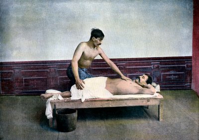 Man having a massage in bath house by Unbekannt