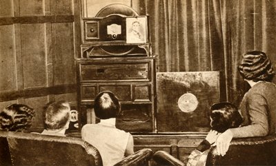 People watching an early television broadcast by Unbekannt