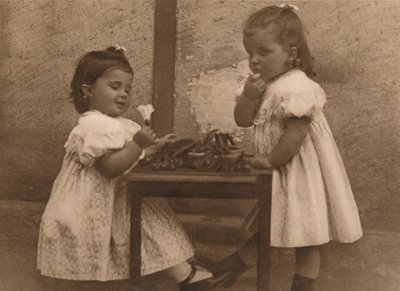 Two Young Girls by a Table by Unbekannt