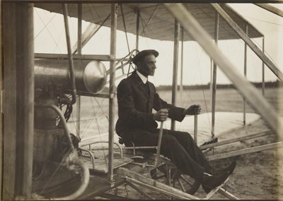 Wilbur Wright in the flyer by Unbekannt