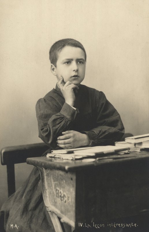 Child listening to a lesson by French Photographer