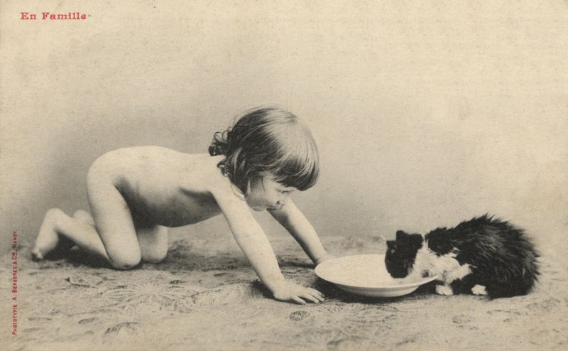 Child with a Kitten by French Photographer