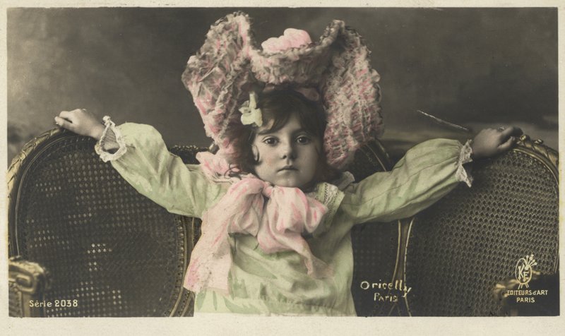 Little girl in a large hat by French Photographer